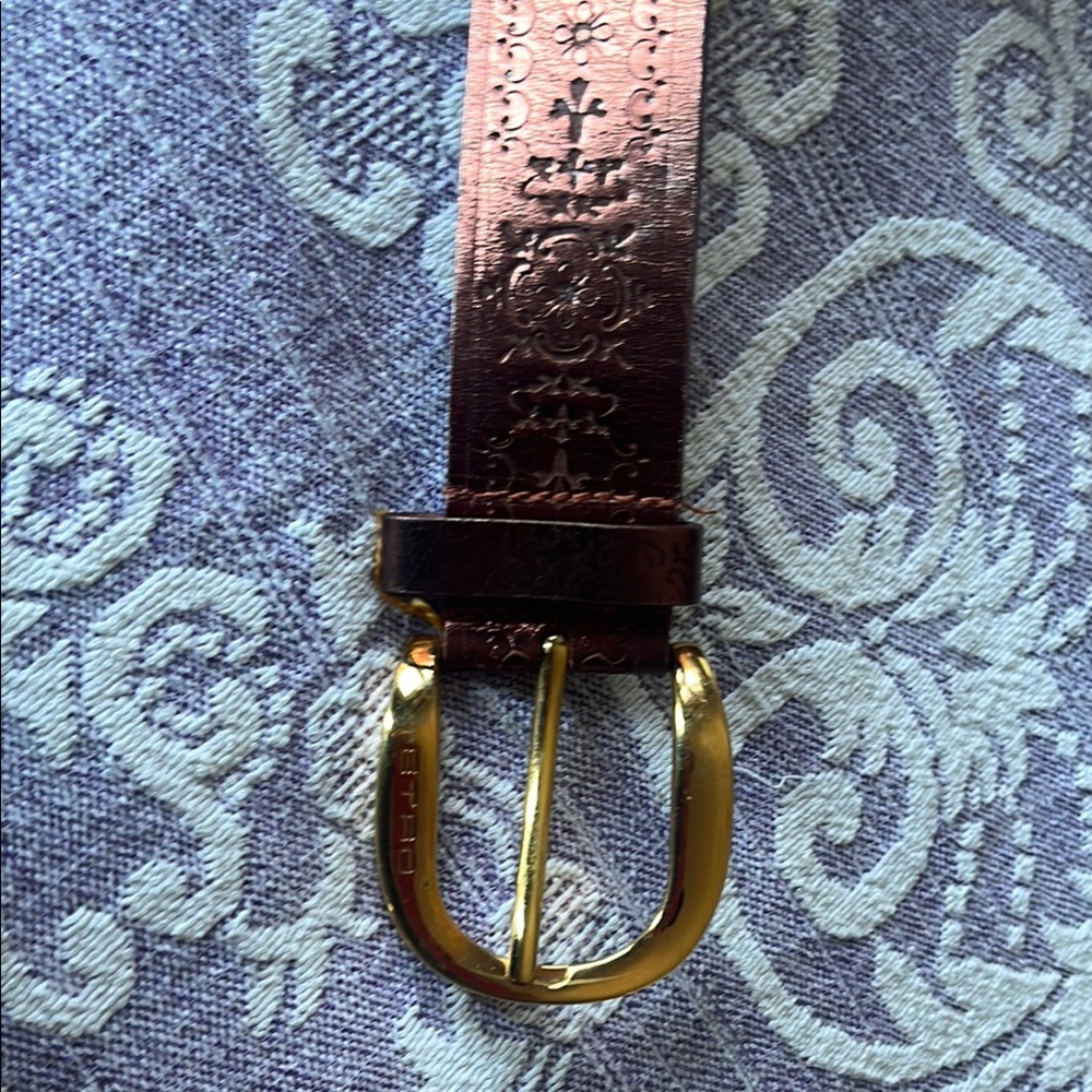 Etro embossed leather copper color wide bet with gold colored buckle. Made in it